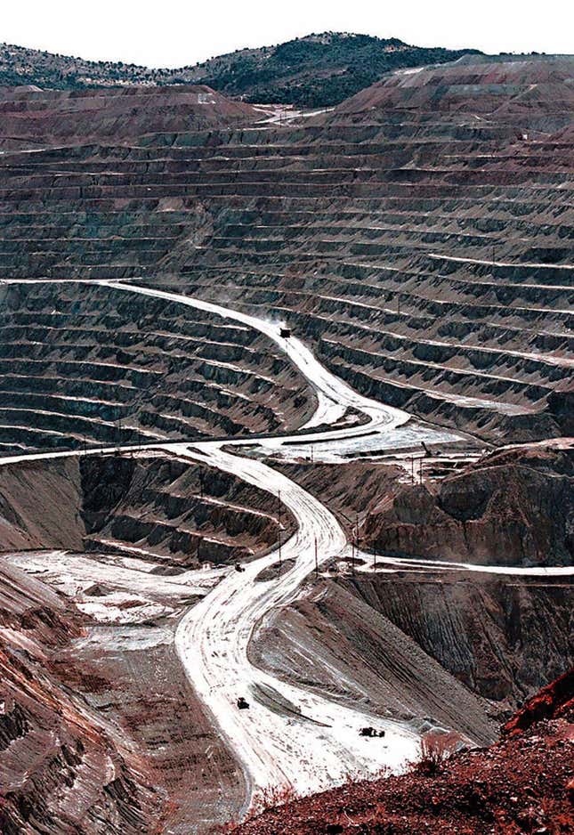 FILE - Terraces cut into the hillside at the huge Santa Rita copper mine in Grant County, N.M., are shown in this March 1999 file photo. The Biden administration is recommending changes to a 151-year-old law that governs mining for copper, gold and other hardrock minerals on U.S.-owned lands, including making companies pay royalties on what they extract. (Richard Pipes/The Albuquerque Journal via AP, File)