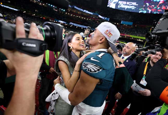 NEW ORLEANS, LOUISIANA - FEBRUARY 09: Jalen Hurts #1 of the Philadelphia Eagles and fiancee, Bry Burrows, embrace after defeating the Kansas City Chiefs 40-22 to win Super Bowl LIX at Caesars Superdome on February 09, 2025 in New Orleans, Louisiana. 