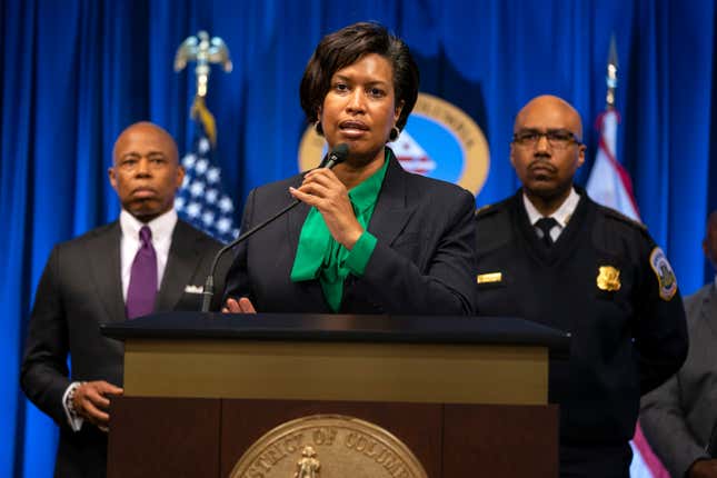 New York Mayor Eric Adams, left, and Washington Metropolitan Police Chief Robert Contee, right, listen as Washington Mayor Muriel Bowser speaks during a news conference about the search for a gunman that has been targeting homeless men sleeping on the streets of Washington, and New York City, Monday, March 14, 2022, in Washington.