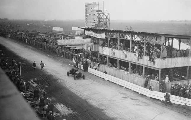 Joe Dawson, the '' Indiana Whirlwind'' of the United States with his riding mechanic Bruce Keene drives the #25 Marmon passed the grandstand during the Vanderbilt Cup races on 1 October 1910 at Long Island Motor Parkway, Hempstead Plains, New York, United States