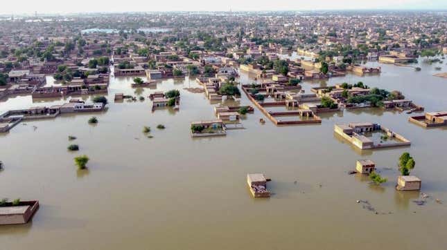 This aerial view shows a flooded residential area after heavy monsoon rains in Balochistan province on August 29, 2022