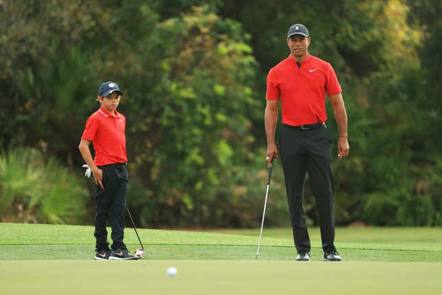 Tiger  and Charlie Woods line up a putt on the third green during the final round of the PNC Championship on December 20, 2020 in Orlando, Fla. 