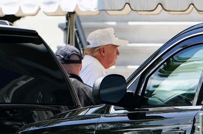 President Donald Trump walks from an SUV upon return to the White House in Washington, DC on May 23, 2020. Trump returned to the White House after spending the day at his Virginia golf club.