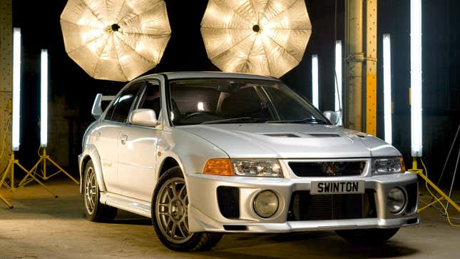 A photo of a silver Mitsubishi Lancer Evo. 