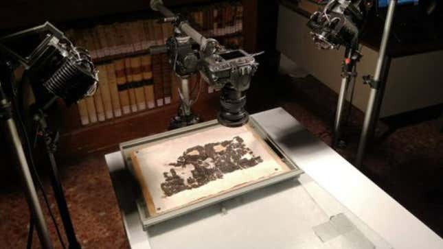 A carbonized papyrus scroll being imaged.