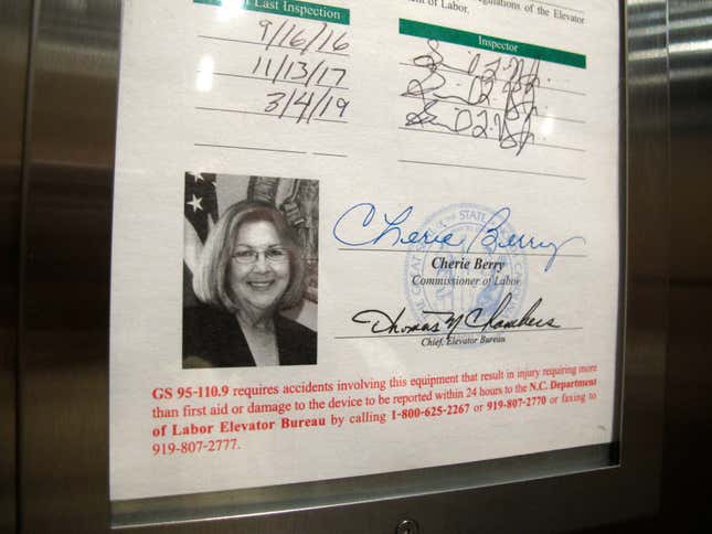 FILE - A photo of North Carolina Labor Commissioner Cherie Berry is displayed on an elevator inspection certificate, April 2, 2019, in Raleigh, N.C. More elevator riders in North Carolina soon won&#39;t see the state labor commissioner staring back at them. Commissioner Josh Dobson had followed longtime predecessor Berry’s practice of inscribing his photo onto elevator inspection certificates, but he said Monday, Oct. 30, 2023, that his photo is being eliminated to make way for a recently redesigned form. (AP Photo/Allen G. Breed, File)