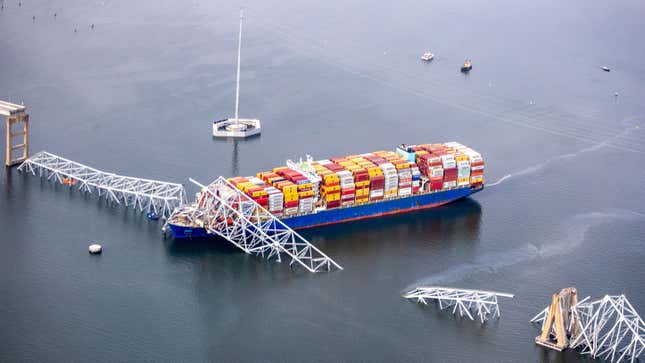 n an aerial view, cargo ship Dali is seen after running into and collapsing the Francis Scott Key Bridge on March 26, 2024 in Baltimore, Maryland. 