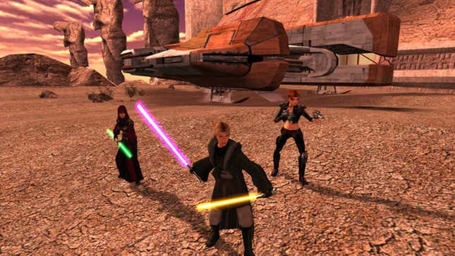 Knights Of The Old Republic II, with three characters sporting light sabres and blasters in front of their ship.