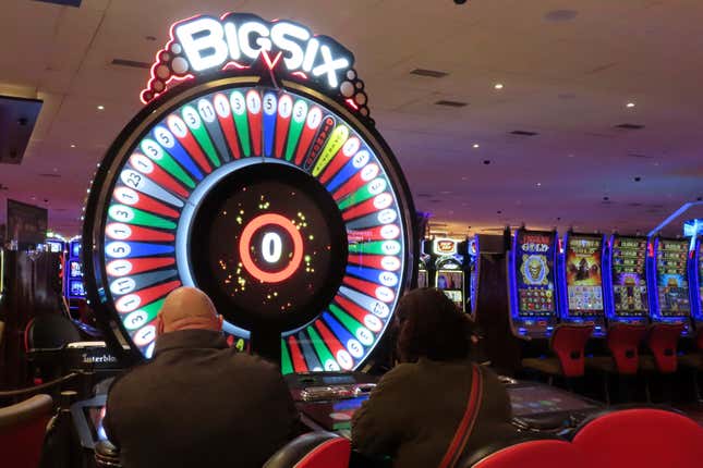 Gamblers play a cash wheel at the Hard Rock casino in Atlantic City, N.J. on Feb. 2, 2024. Figures released on Friday, Feb. 16, from state gambling regulators show the total amount won by Atlantic City&#39;s nine casinos, the three horse tracks that take sports bets, and their online partners was more than $559 million in January, up 28% from a year earlier. But much of that was powered by a record-setting month of internet gambling ($183 million, up nearly 20% from a year ago) and sports betting (nearly $171 million, up more than 136%). (AP Photo/Wayne Parry)