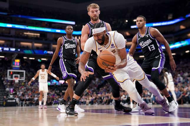 Oct 29, 2023; Sacramento, California, USA; Los Angeles Lakers forward Anthony Davis (3) falls to the ground after being fouled by Sacramento Kings forward Domantas Sabonis (10) in the second quarter at the Golden 1 Center.