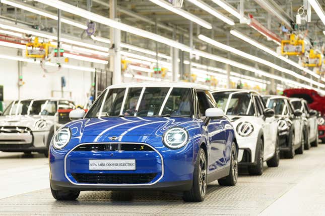 MINI cars stand in a row at the MINI plant at Cowley in Oxford, England, Monday, Sept. 11, 2023. German automaker BMW is set to announce plans to build the next generation electric Mini in Britain after securing U.K. government support for a multimillion-pound investment in the company’s Oxford factory. The government on Monday confirmed its backing for the project, which will protect 4,000 jobs. (Joe Giddens/PA via AP)