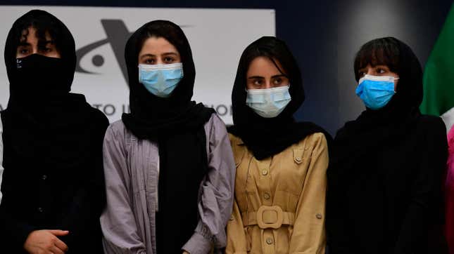 Four members of the Afghan Girls Robotics Team, as seen at Benito Juarez International Airport in Mexico City on Aug. 24, 2021, after receiving refugee status there.