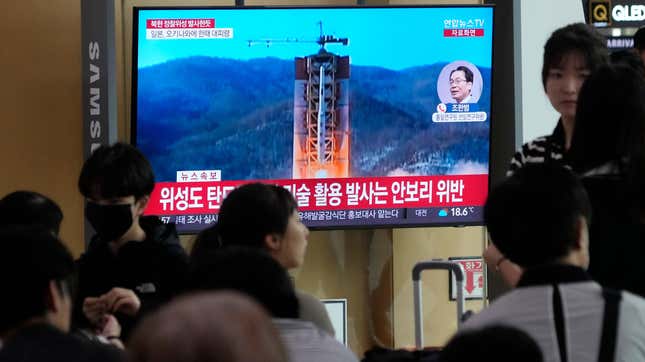 A TV screen shows a file image of North Korea's rocket launch during a news program at the Seoul Railway Station in Seoul, South Korea, Wednesday, May 31, 2023.