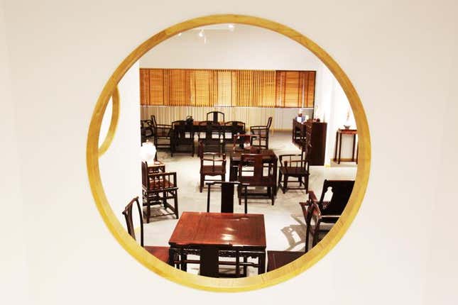 Chinese rosewood furniture in a showroom.