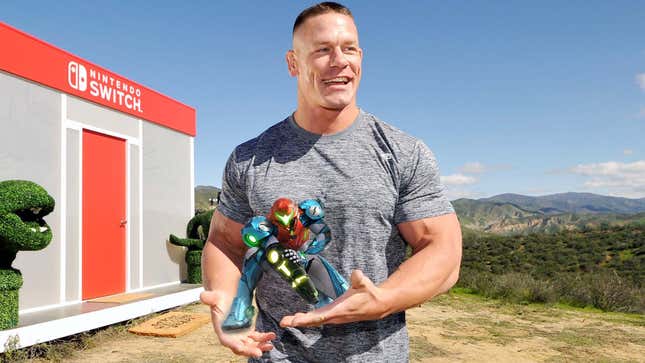 John Cena stands outside of a Nintendo building while holding Samus Aran.