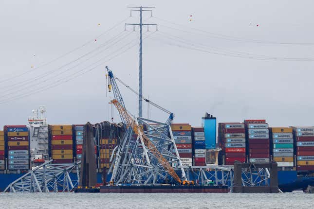 Salvage work continues on the collapsed Francis Scott Key Bridge, Tuesday, April 2, 2024, in Baltimore. (AP Photo/Julia Nikhinson)