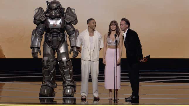 The cast of the Fallout TV series stands onstage at The Game Awards 2023.