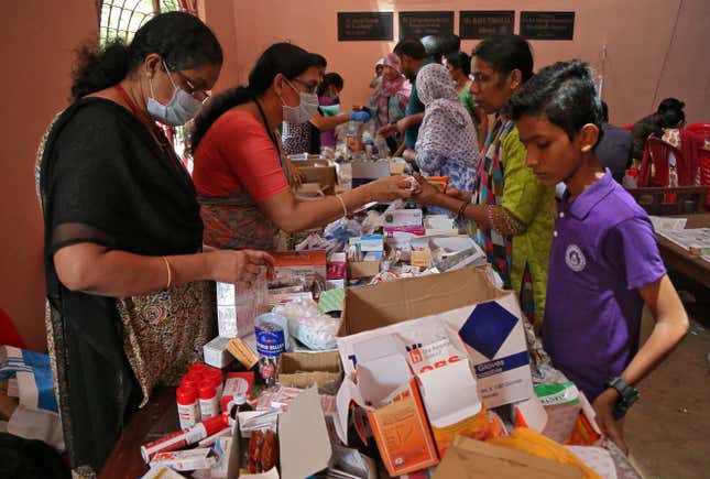 Free medicines being distributed at a temporary relief camp inside a college in Aluva.