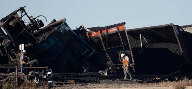 FILE - Workers toil to clear rail cars that derailed and collapsed a bridge over Interstate 25 northbound, Monday, Oct. 16, 2023, north of Pueblo, Colo. Federal investigators said Thursday they’re looking at BNSF Railway’s inspection and maintenance practices as the investigate the accident that killed a truck driver passing beneath the train. (AP Photo/David Zalubowski, File)