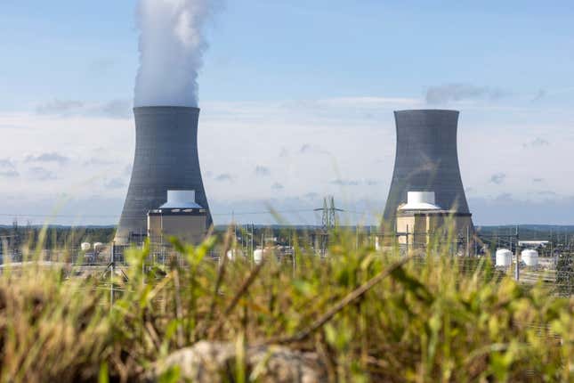 FILE - The first of two new nuclear reactors, left, operates at Plant Vogtle, July 31, 2023, in Burke County near Waynesboro, Ga., while the second reactor, right, awaits completion. In hearings that began on Monday, Dec. 4, Georgia Power Co. is asking the state Public Service Commission to approve a further 6% increase in customer bills to pay for the second unit. (Arvin Temkar/Atlanta Journal-Constitution via AP, File)