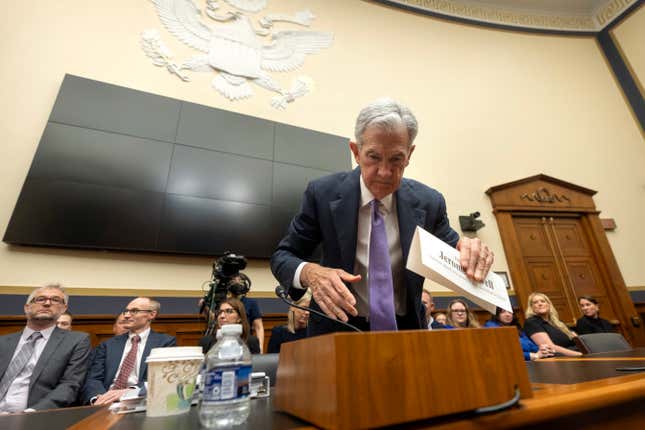 Federal Reserve Board Chair Jerome Powell adjusts his name card before his appearance before the House Financial Services Committee on Capitol Hill, Wednesday, March 6, 2024, in Washington. (AP Photo/Mark Schiefelbein)