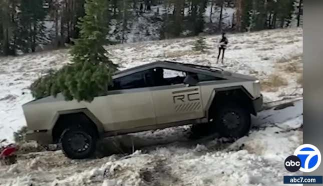 A screenshot of the video of the Cybertruck getting winched off of a snowy incline that it failed to climb,