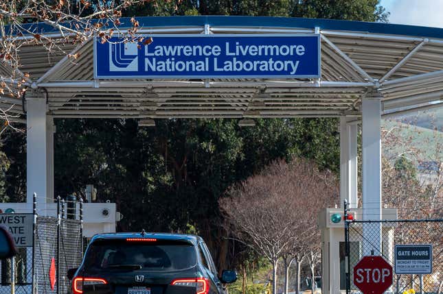 Lawrence Livermore National Laboratory sign on a gate that a car is driving through