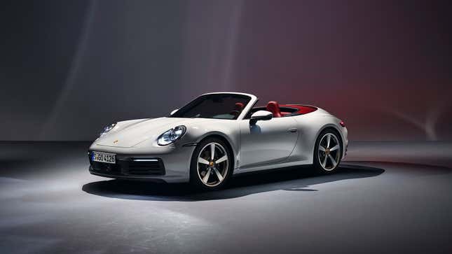 A photo of a white Porsche 992 Carrera Cabriolet. 