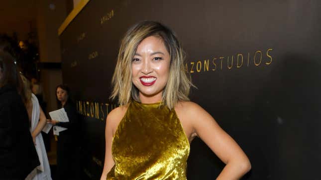Cathy Yan in a gold dress.
