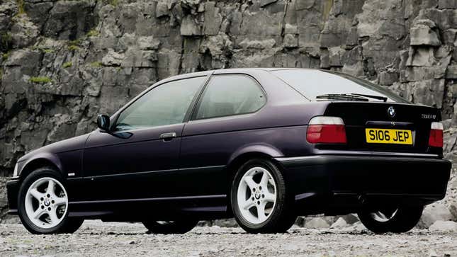 A photo of a purple E63 BMW 3 Series. 