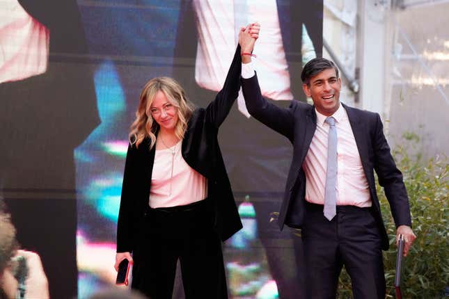 Italy&#39;s Prime Minister Giorgia Meloni, left, and Britain&#39;s Prime Minister Rishi Sunak cheer as they leave the annual political festival Atreju, organized by the Giorgia Meloni&#39;s Brothers of Italy political party, in Rome, Saturday, Dec. 16, 2023. (AP Photo/Alessandra Tarantino)