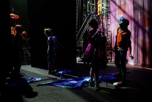 Clowns with the Ringling Bros. circus red unit wait backstage for the start of the show, May 5.