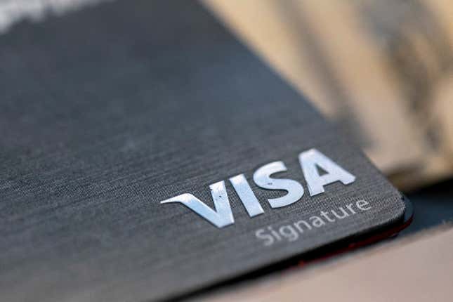 FILE - This Aug. 11, 2019, file photo shows a Visa logo on a credit card in New Orleans. Visa reports earnings on Tuesday, Oct. 24, 2023. (AP Photo/Jenny Kane, File)