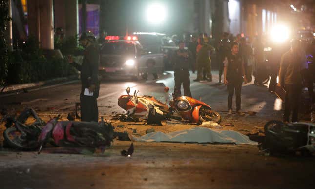 Motorcycles and debris lies on the pavement after the explosion.
