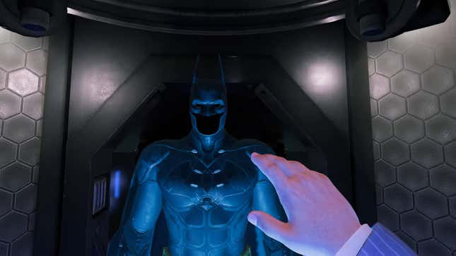 A screenshot showing a first-person vie of Bruce Wayne reaching out to the Batsuit in Batman: Arkham Shadow.