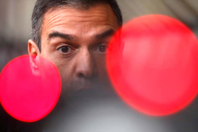 FILE. Spain&#39;s Prime Minister Pedro Sanchez speaks on camera as he arrives for an EU summit at the European Council building in Brussels, Thursday, Oct. 1, 2020. Sánchez says he will continue in office &quot;even with more strength&quot; after days of reflection. Sánchez shocked the country last week when he said he was taking five days off to think about his future after a court opened preliminary proceedings against his wife on corruption allegations. (AP Photo/Francisco Seco, File)