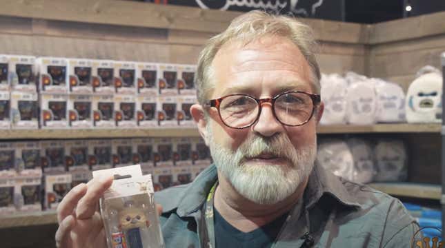 Actor Mark Dodson surrounded by Star Wars Funkos at Star Wars Celebration 2019.