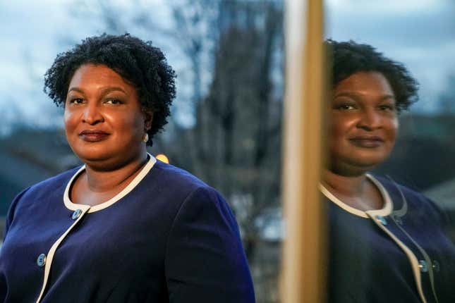 Georgia gubernatorial Democratic candidate Stacey Abrams poses for a photo during an interview with The Associated Press on Dec. 16, 2021, in Decatur, Ga.