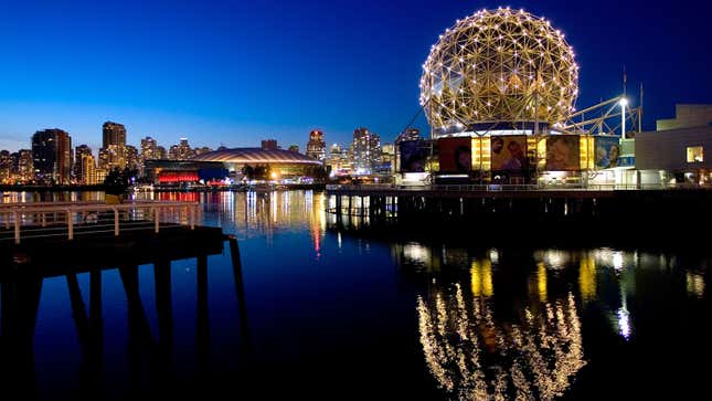 A photo of the Vancouver skyline at night. 