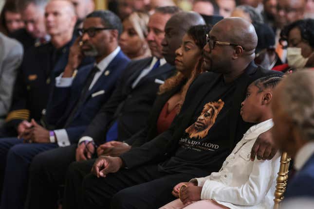 George Floyd’s brother Philonise Floyd (2nd from Right) and George Floyd’s daughter Gianna Floyd (Right) watch as President Joe Biden signs a historic Executive Order to advance effective, accountable policing and strengthen public safety during an event held in the East Room of The White House in Washington, DC on May 25, 2022.