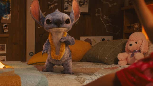 Stitch stands on a bed.