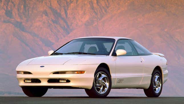 A white Ford Probe coupe 