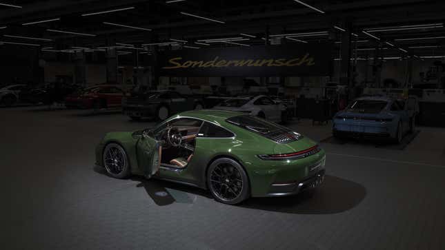 3/4 rear view of a green Porsche 911 Cuarenta Edition