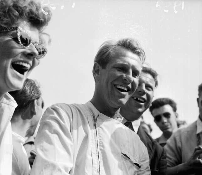 British racing driver Peter Collins celebrating his win at the British Grand Prix, Silverstone, July 19th 1958. Collins would be killed the same year at the German Grand Prix