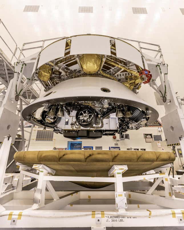 The Mars 2020 Perseverance rover mission's disk-shaped cruise stage sits atop the bell-shaped back shell, which contains the powered descent stage and Perseverance rover. Below is the brass-colored heat shield that is about to be attached to the back shell. The image was taken on May 28, 2020, at Kennedy Space Center in Florida. The next time the back shell and cruise stage will separate will be about 6 miles (9 kilometers) above Mars' Jezero Crater on Feb. 18, 2021.