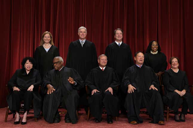 WASHINGTON, DC - OCTOBER 07: United States Supreme Court (front row L-R) Associate Justice Sonia Sotomayor, Associate Justice Clarence Thomas, Chief Justice of the United States John Roberts, Associate Justice Samuel Alito, and Associate Justice Elena Kagan, (back row L-R) 