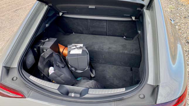 A photo of the trunk space in the AMG GT and the giant lump in the floor from the battery