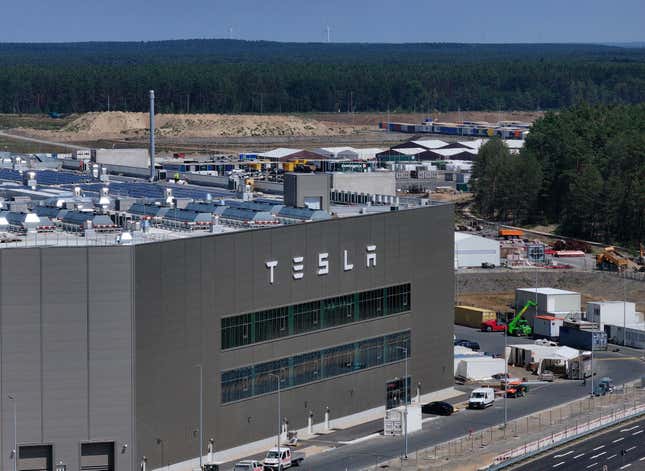  In this aerial view the Tesla logo hangs on the facade of a building at the Tesla factory on July 17, 2023 near Gruenheide, Germany. 