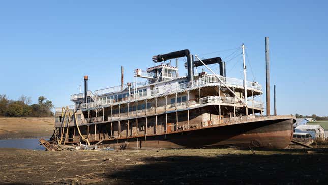 The Diamond Lady, a once majestic riverboat, rests in mud at Riverside Park Marina in Martin Luther King Jr. Riverside Park along the Mississippi River on October 19, 2022 in Memphis, Tennessee. Lack of rain in the Ohio River Valley and along the Upper Mississippi has the Mississippi River south of the confluence of the Ohio River nearing record low levels which is wreaking havoc at marinas, and with barge traffic, driving up shipping prices and threatening crop exports and fertilizer shipments as the soybean and corn harvest gets into full swing.