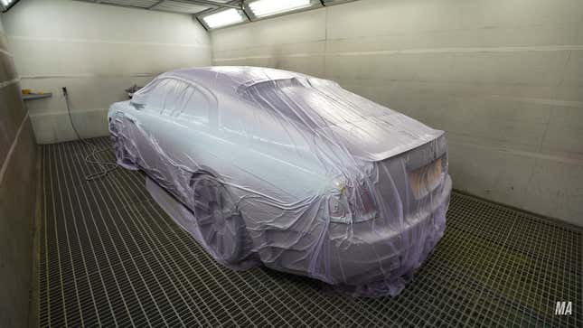 A photo of a Rolls-Royce in the Mansory paintshop. 